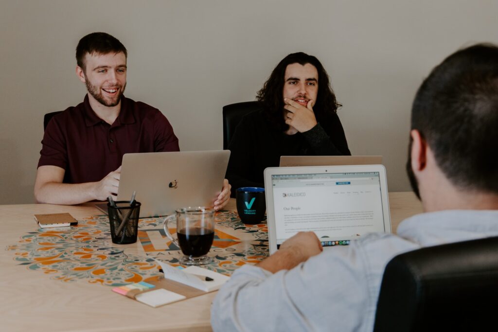 Three men meeting together