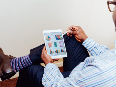 Man looking at charts on his tablet